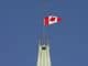 The flag flies at half-mast on the Peace tower in Ottawa.