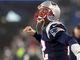 Patriots quarterback Tom Brady (12) gets ready for