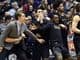 The Northwestern bench reacts to a play against Indiana