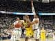 Michigan guard Derrick Walton Jr. (10) splits the defense