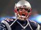 Patriots quarterback Tom Brady (12) gets ready for