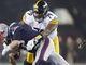 Patriots quarterback Tom Brady (12) is sacked by Steelers