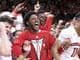 Nebraska players celebrate after defeating Purdue.