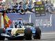Fernando celebrates with his Renault team members as