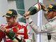 Lewis Hamilton, right, sprays champagne on Fernando