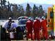 Fernando Alonso receives medical assistance after crashing