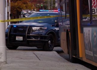 Man shot in chest after altercation on Metro bus spills onto Seattle street; 1 in custody
