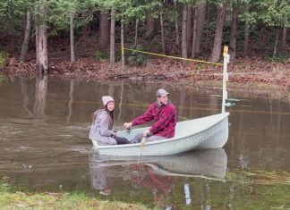 Lake Tapps road remains flooded as county blames private property owner
