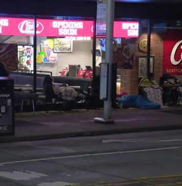 People line up overnight in Seattle’s U District for Raising Cane’s grand opening