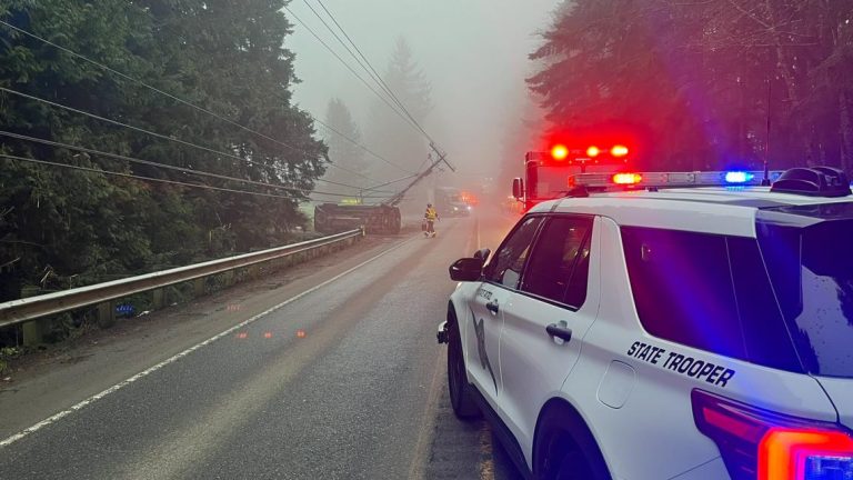 Collision involving two vehicles, power pole shuts down SR 104 in Kitsap County