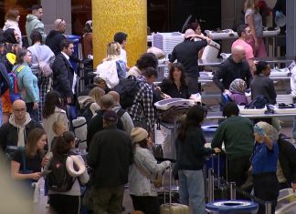 When is the busiest spring break travel day at SEA Airport?